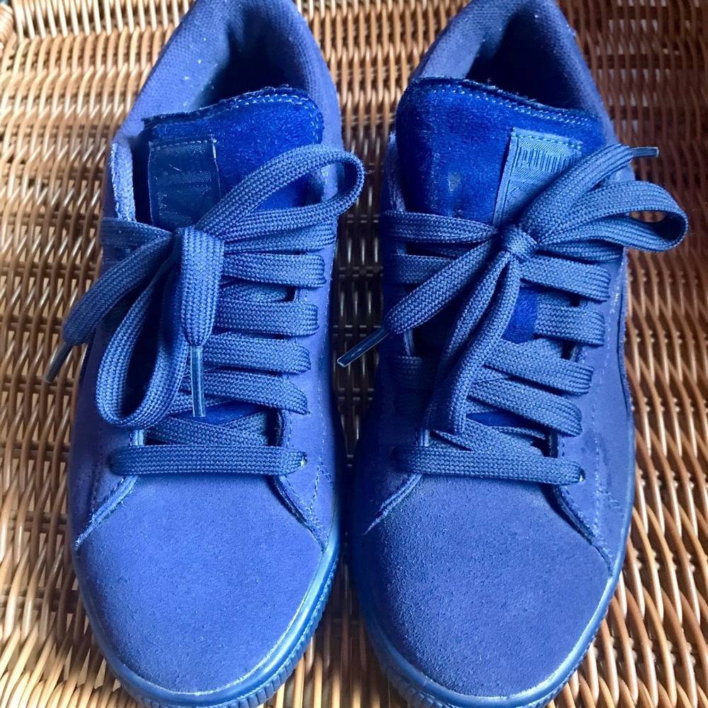 Purple suede Pumas